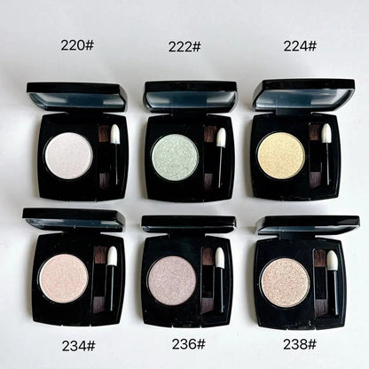 Close-up view of the eye shadow palette showing the included brush