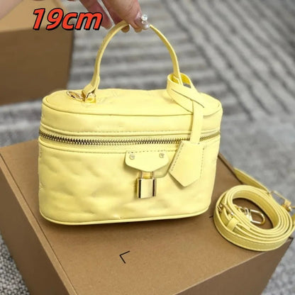 Front view of a mini leather cosmetic bag with crossbody strap
