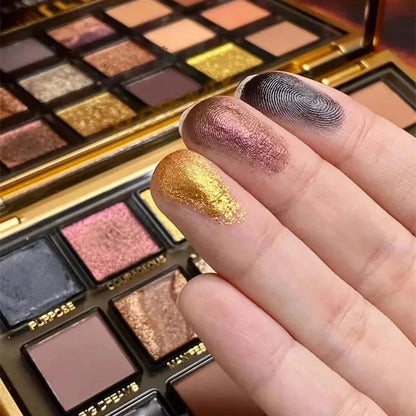 Open eyeshadow palette displaying neutral, rose gold, and deeper tone shades