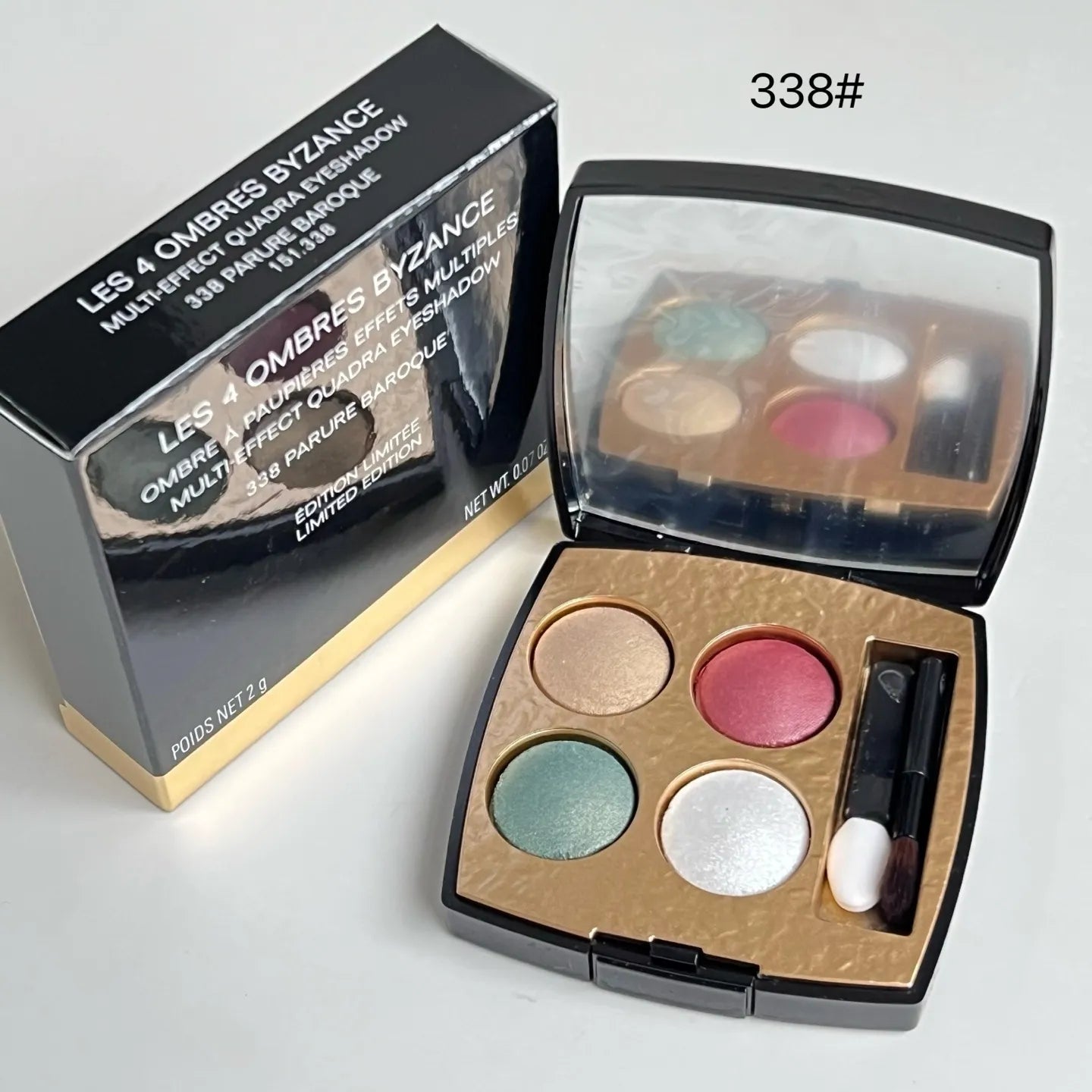 Swatch demonstration of four eyeshadow colors on skin