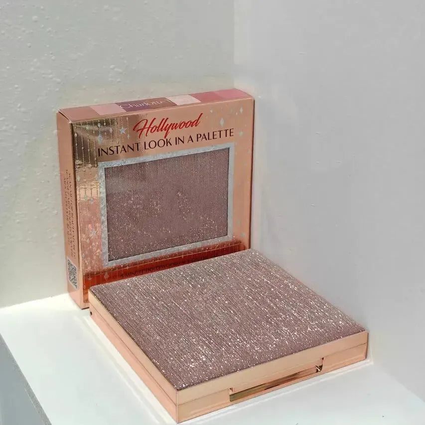 Makeup palette with eyeshadow, blush, and highlighter compartments