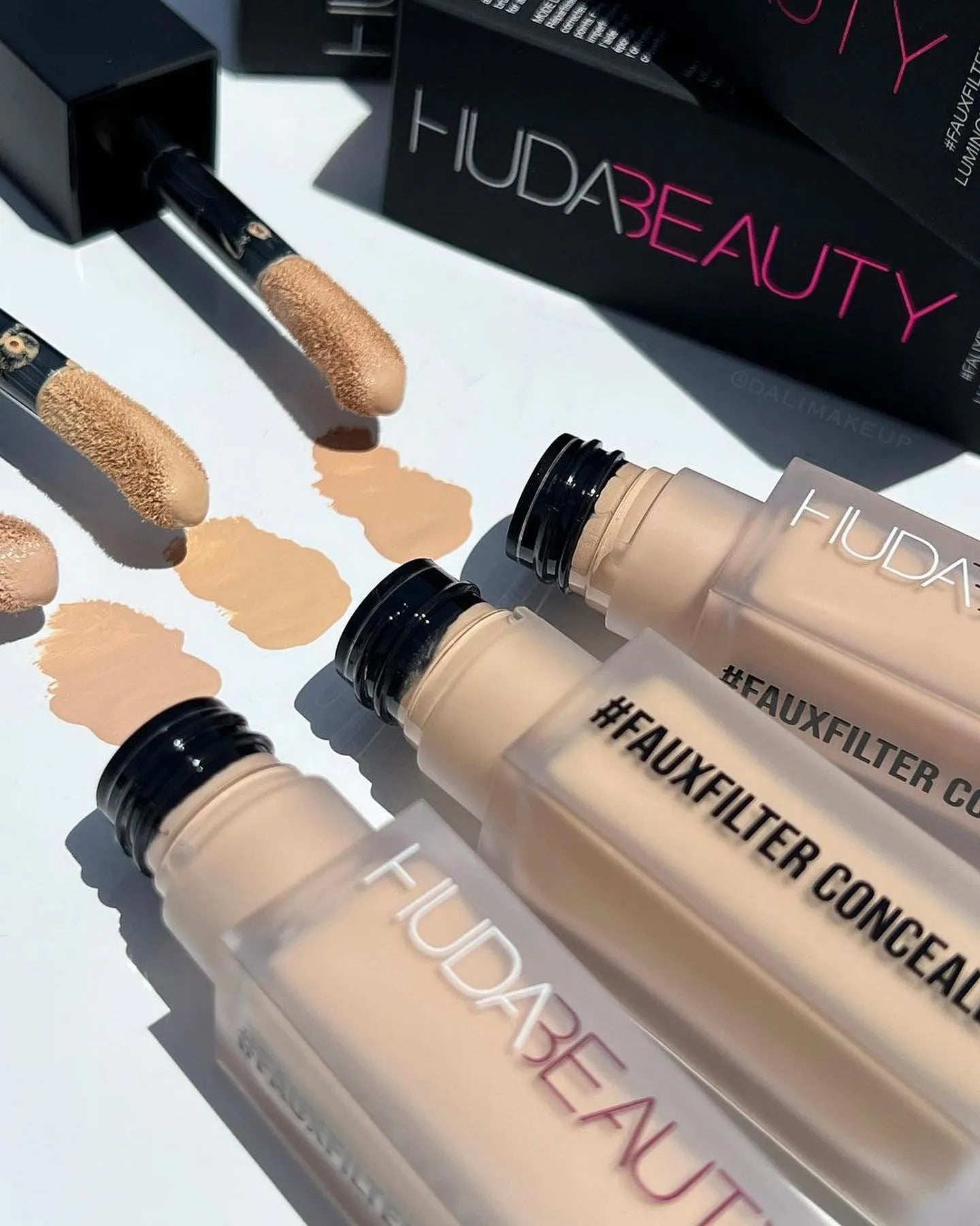 Close-up view of concealer being applied to under-eye area