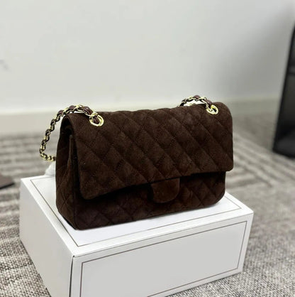 Side view displaying adjustable shoulder strap and bag dimensions