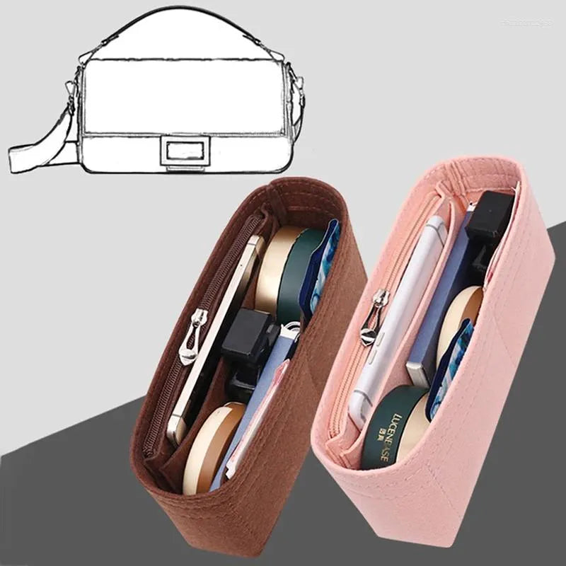 Black felt organizer placed inside a handbag to demonstrate fit and use
