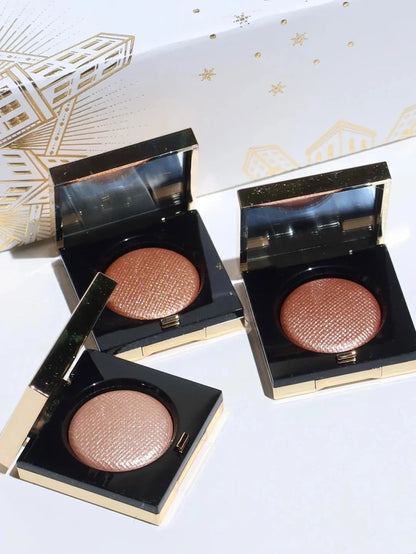 Three-color eyeshadow palette showing matte and metallic shades