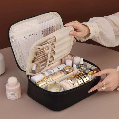Makeup bag showing multiple compartments for brush and cosmetic organization