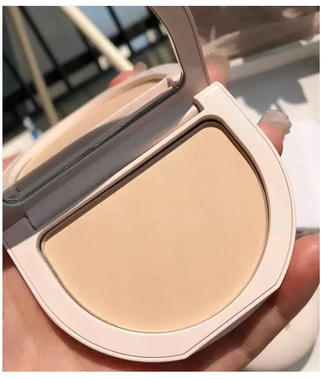 Swatch demonstration showing three different powder shades on skin
