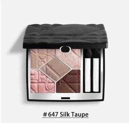 Open eyeshadow palette displaying creamy powder formula texture