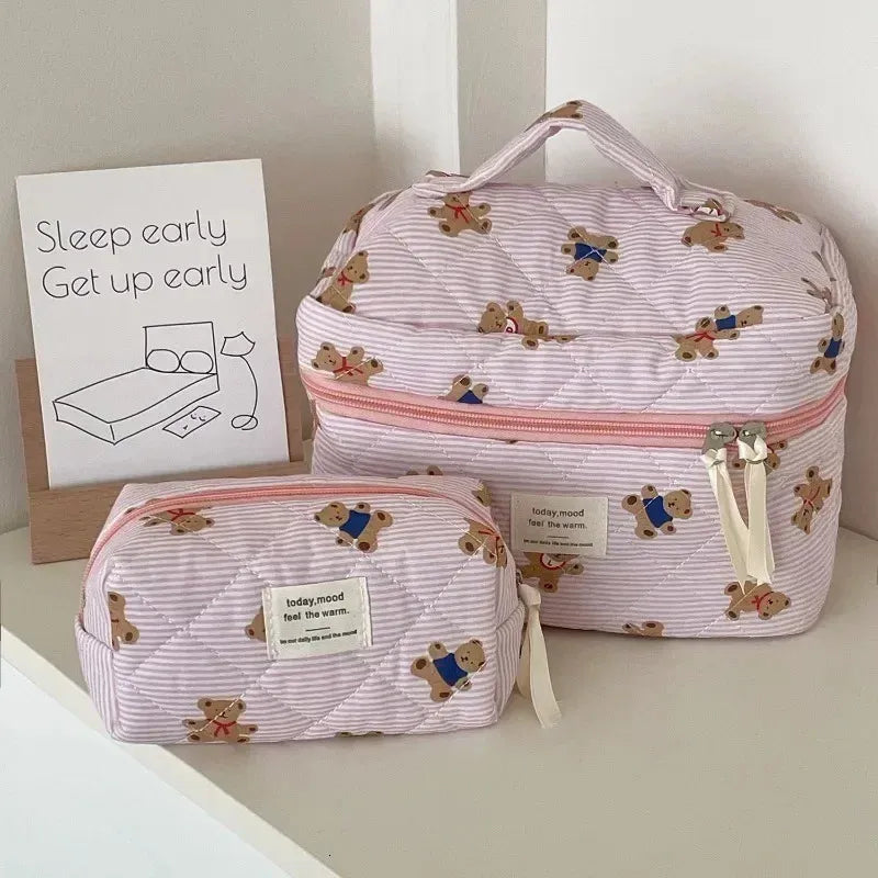 Cosmetic bag in various color options displayed on a flat surface