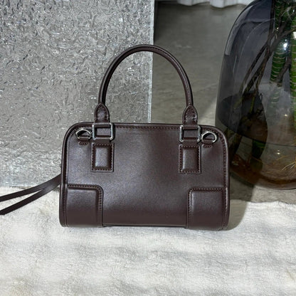 Side angle of the tote bag displaying compartments and size
