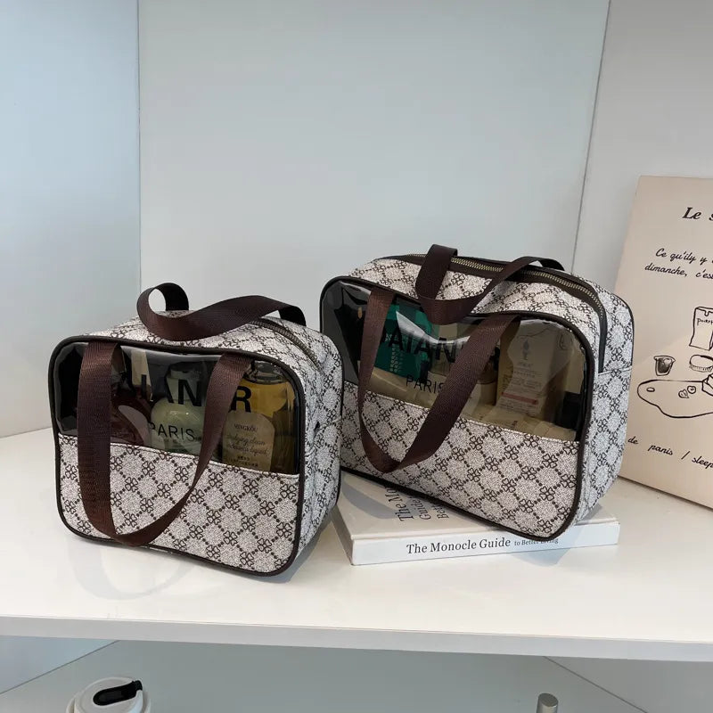 Portable toiletry bag in neutral color with structured compartments visible