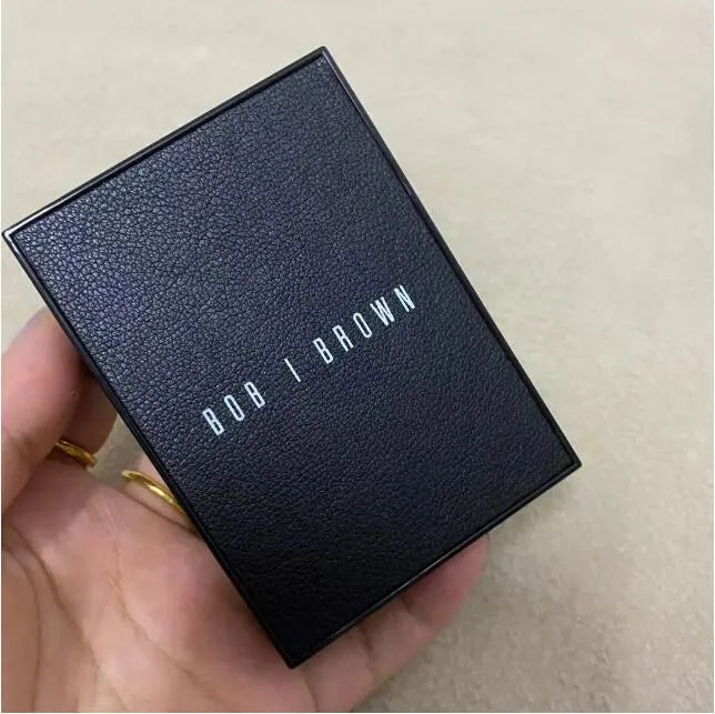 Close-up view of eye shadow palette showing matte and shimmer finishes