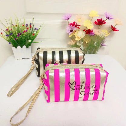 Front view of small stripe cosmetic bag showing waterproof material