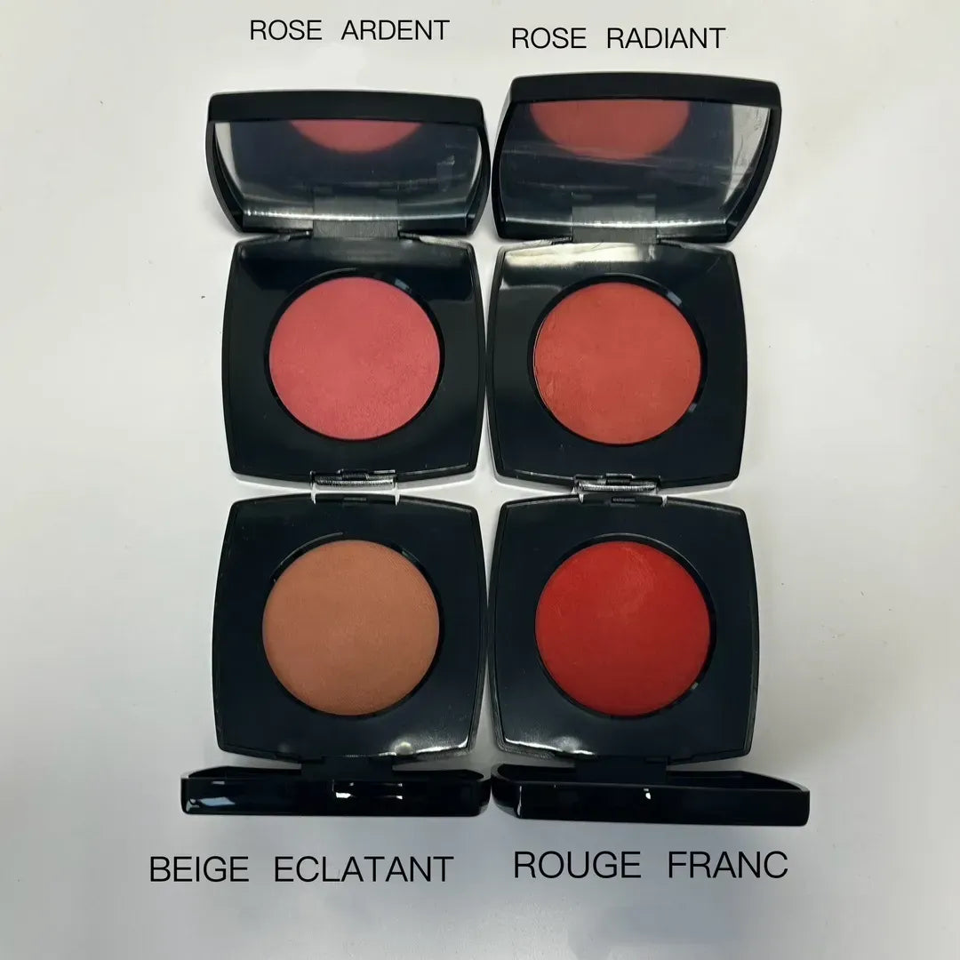 Close-up of blush colors with application brush