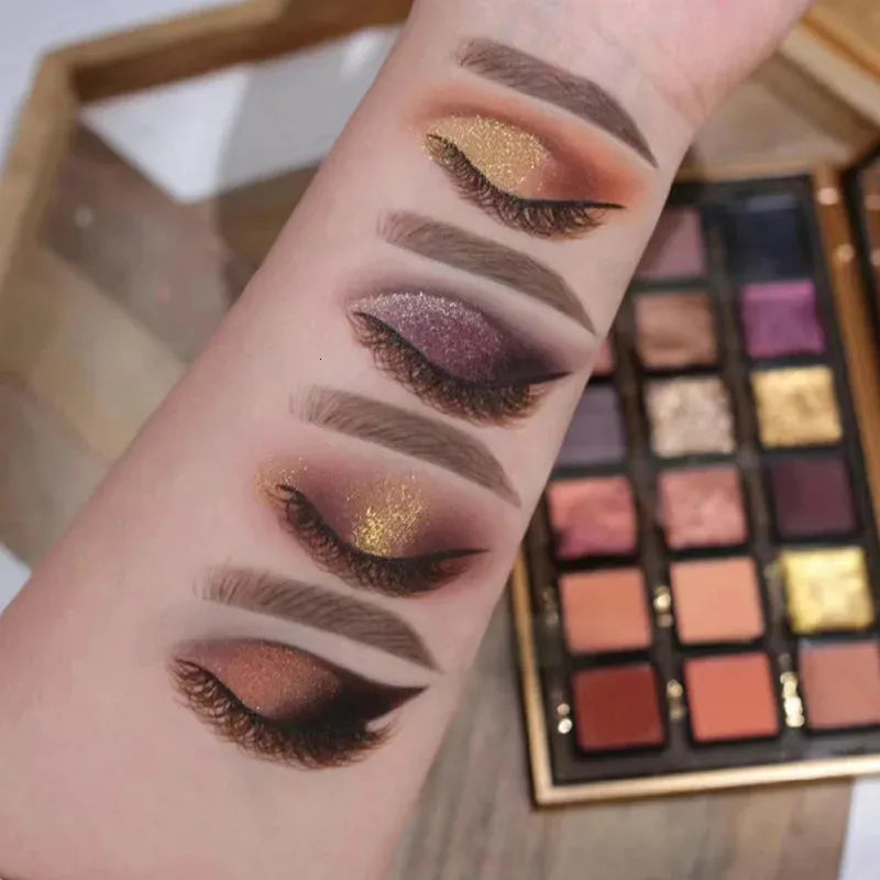 Close-up view of eyeshadow palette with matte and pearlescent glitter textures