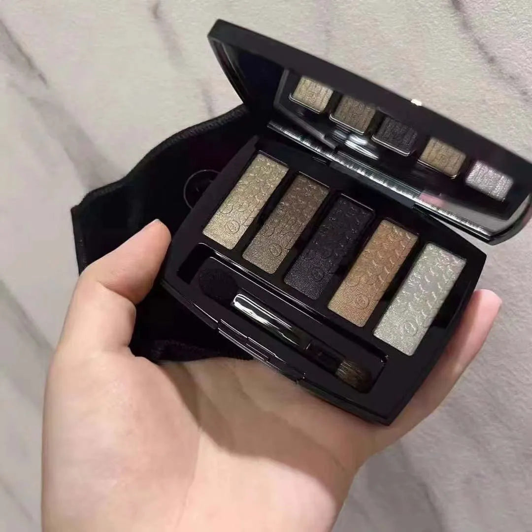 Christmas eyeshadow palette showing five color swatches