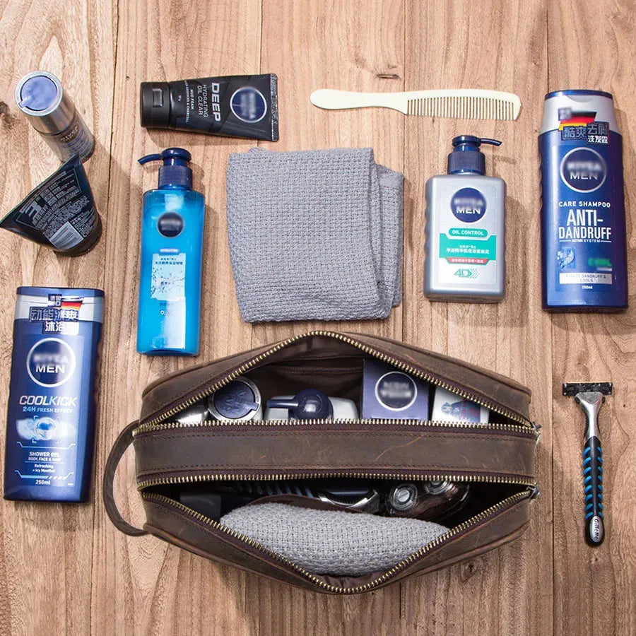 Interior view of leather toiletry bag showing multiple compartments for organization