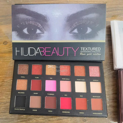Open 18-color eyeshadow palette showing various shades