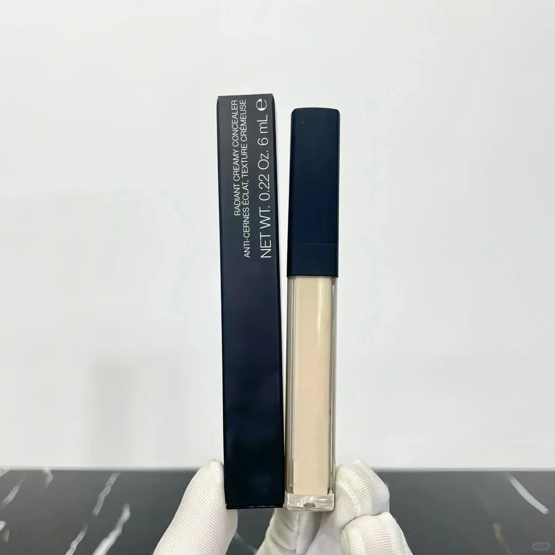 Four different shade options of creamy liquid concealer displayed together