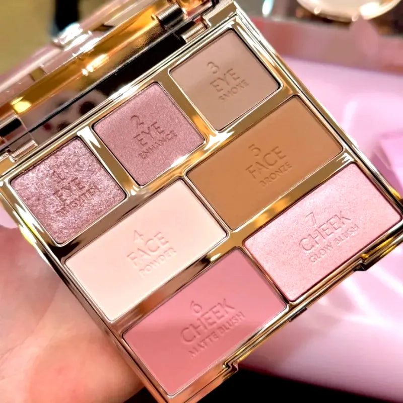 Open palette displaying seven coordinated makeup shades for eyes and cheeks