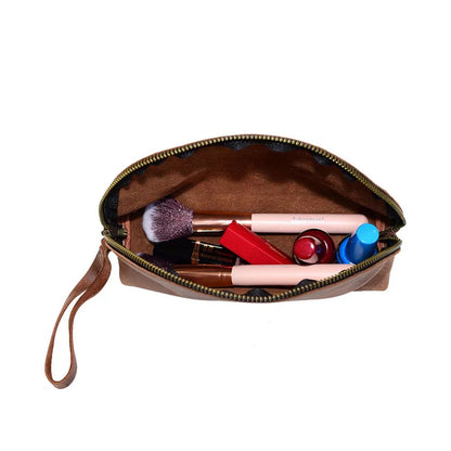 Side angle showing the soft cowhide texture and compact size of the coin purse