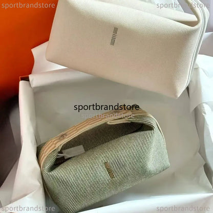 Compact vanity case in lavender color with shoulder strap