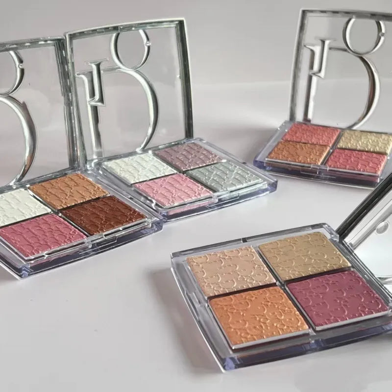 Swatch demonstration of four eyeshadow shades on skin showing pigmentation and finish