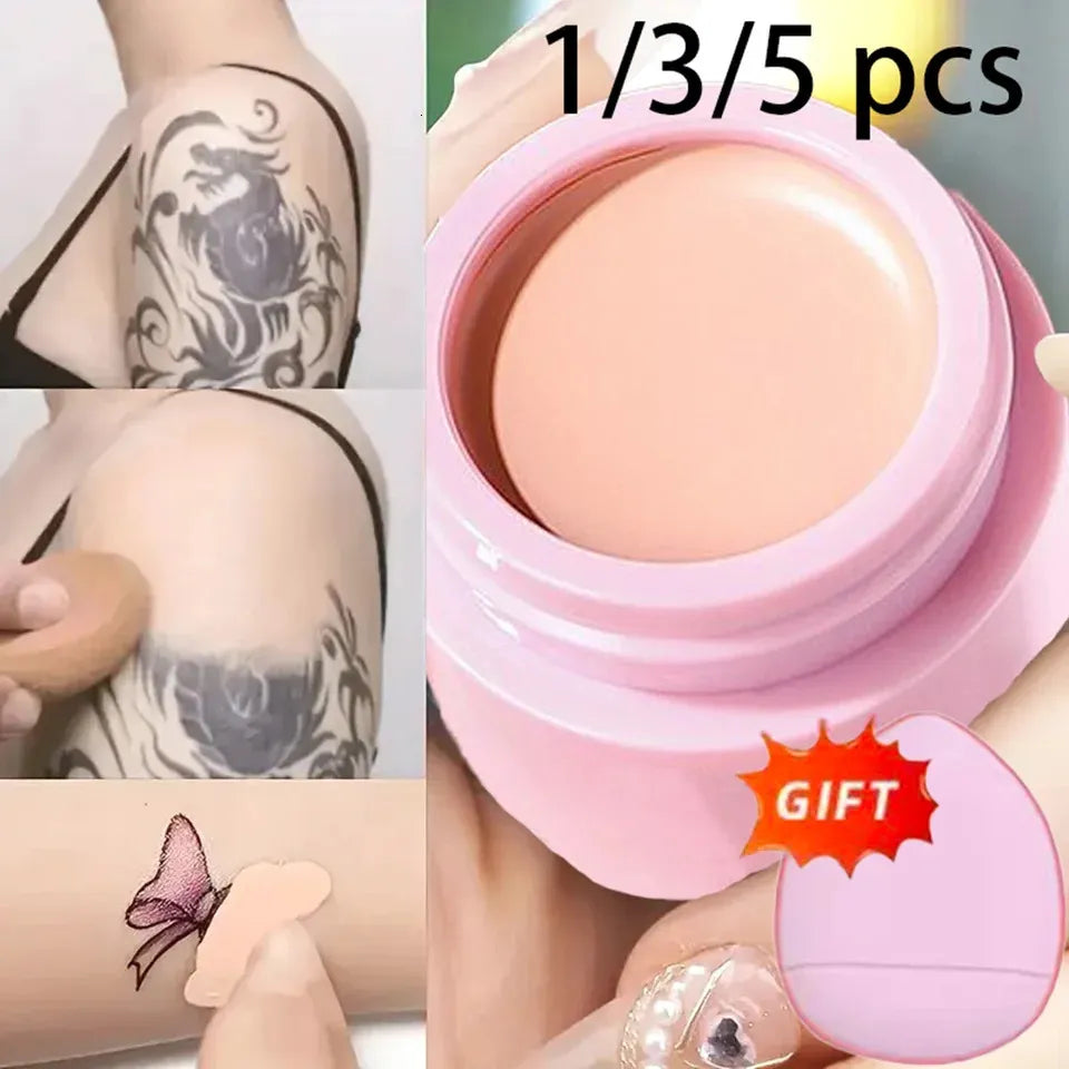 Concealer cream being applied to skin with a fingertip