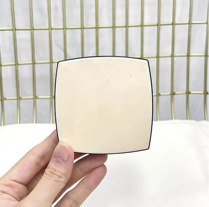 Close-up view of eyeshadow palette showing smooth texture and glow finish