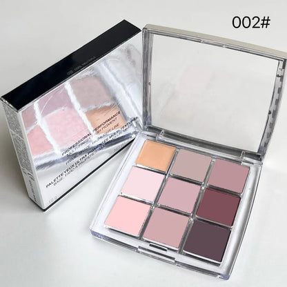 Swatch display of eyeshadow shades from the palette on skin