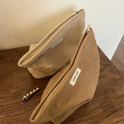 Corduroy toiletry bag with Maillard color pattern shown in khaki