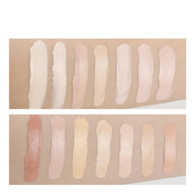 Concealer tube shown next to cosmetic brush on flat surface
