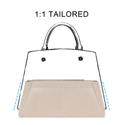 Deep grey cosmetic organizer placed inside a compatible handbag model