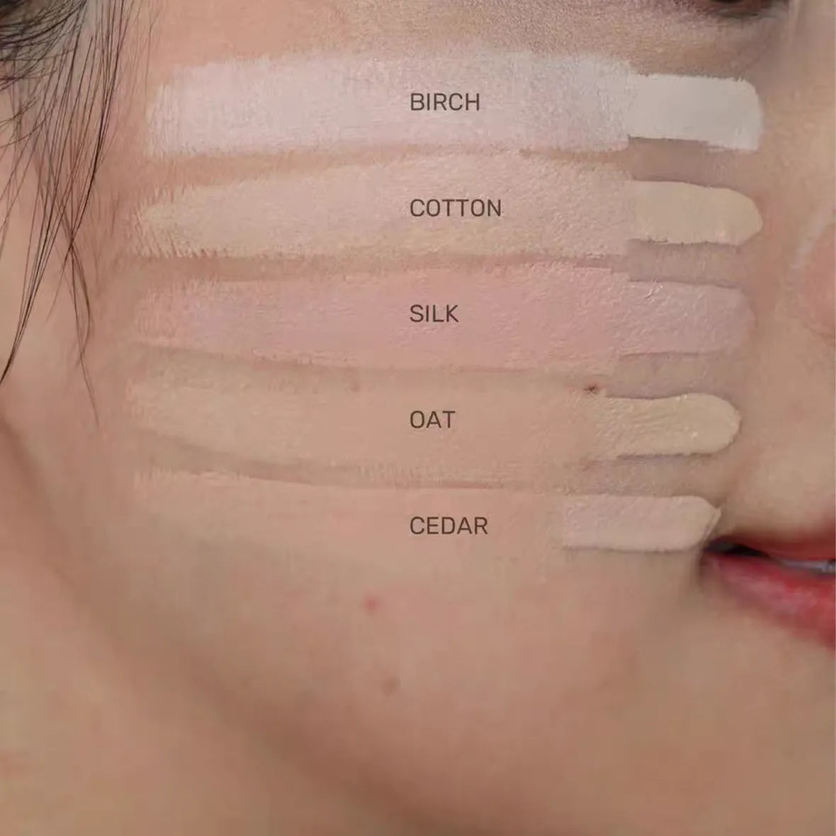 Concealer being applied to under-eye area with blending brush