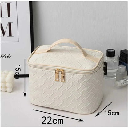 Side perspective of portable makeup bag showing handheld design