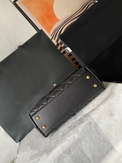 Front view of a women's leather crossbody bag with gold metal flap closure