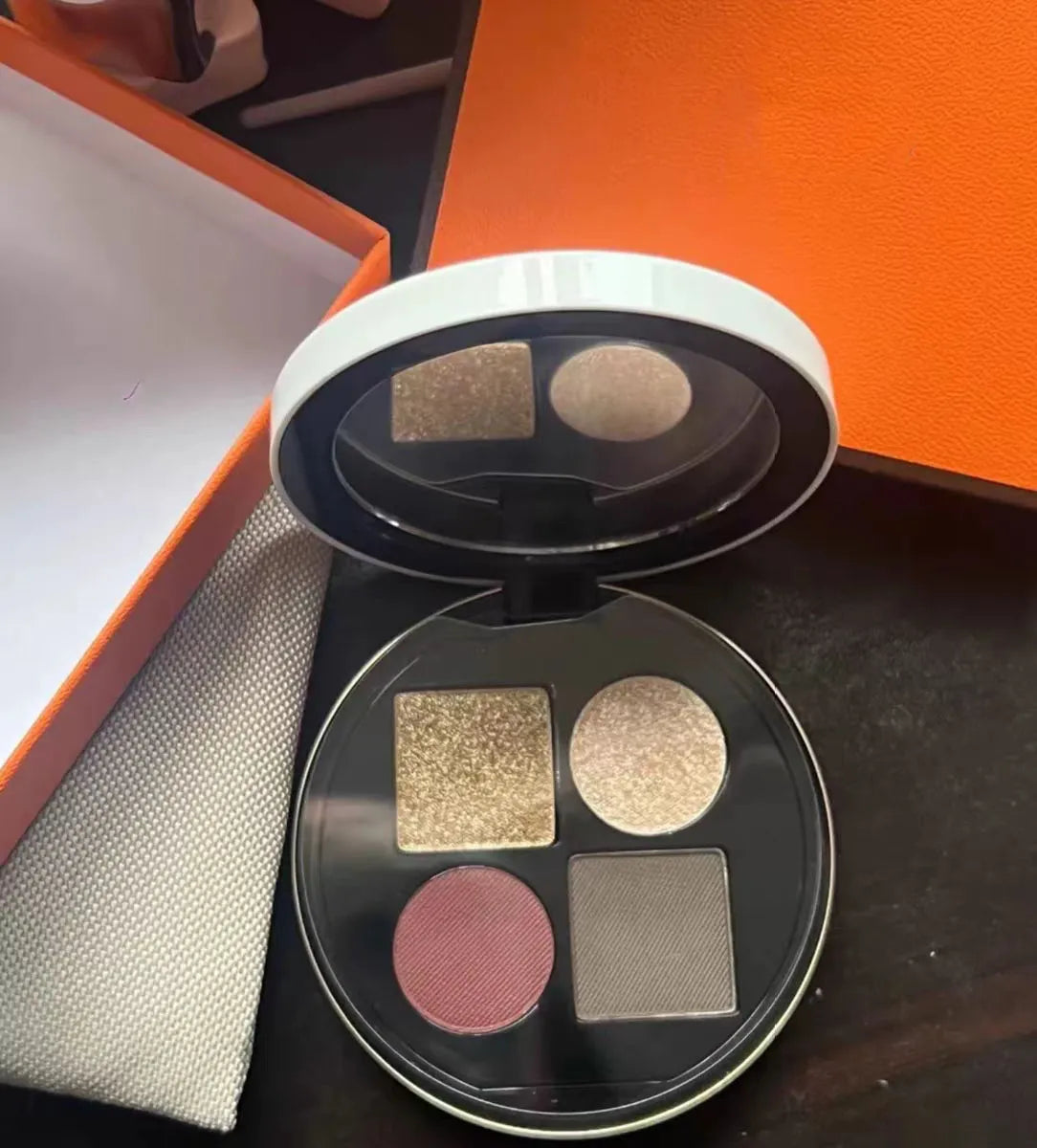 Open eyeshadow palette showing four gradient shades