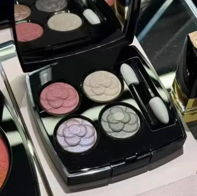 Eyeshadow palette open showing matte and shimmer finish options