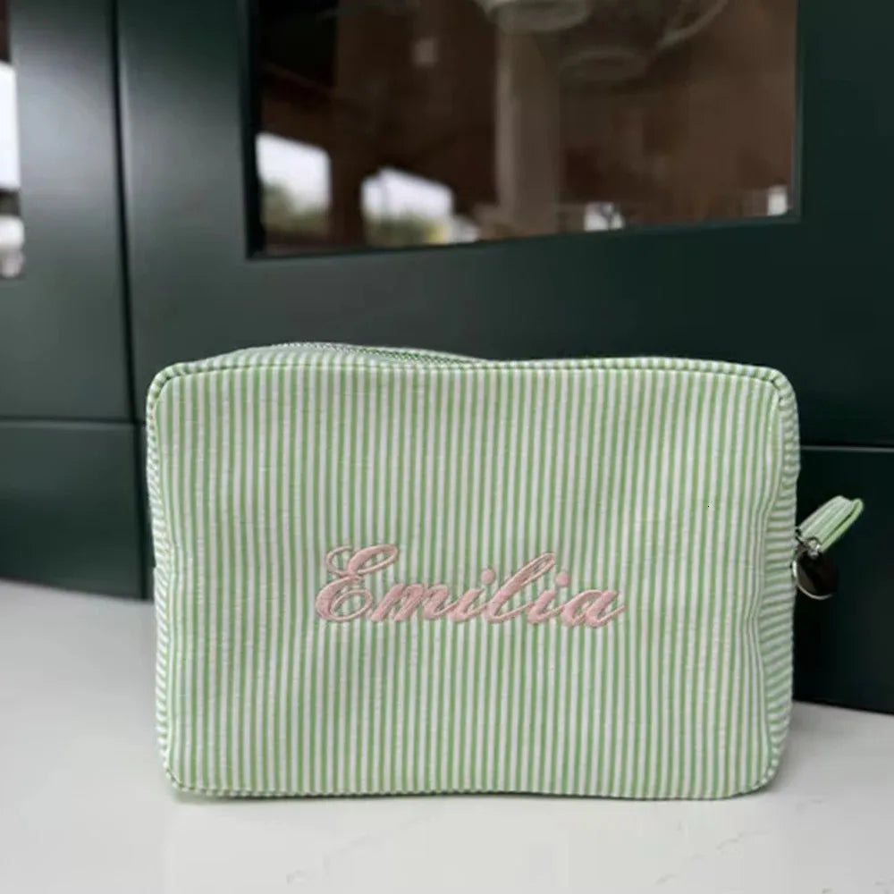 Front view of personalized seersucker cosmetic bag with monogram embroidery