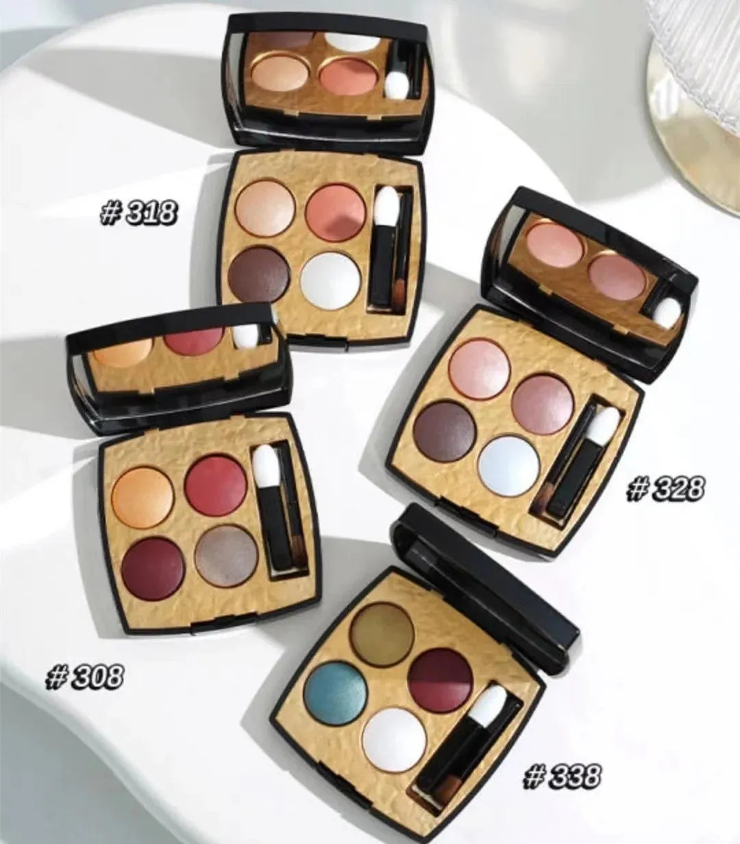Four-color eyeshadow palette showing matte and shimmer finishes