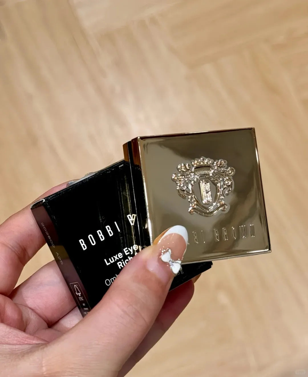 Close-up view of eyeshadow pans with smoky color gradient
