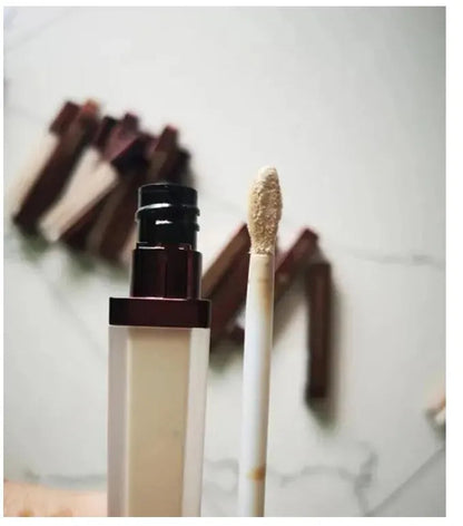 Close-up view of cream concealer texture and consistency