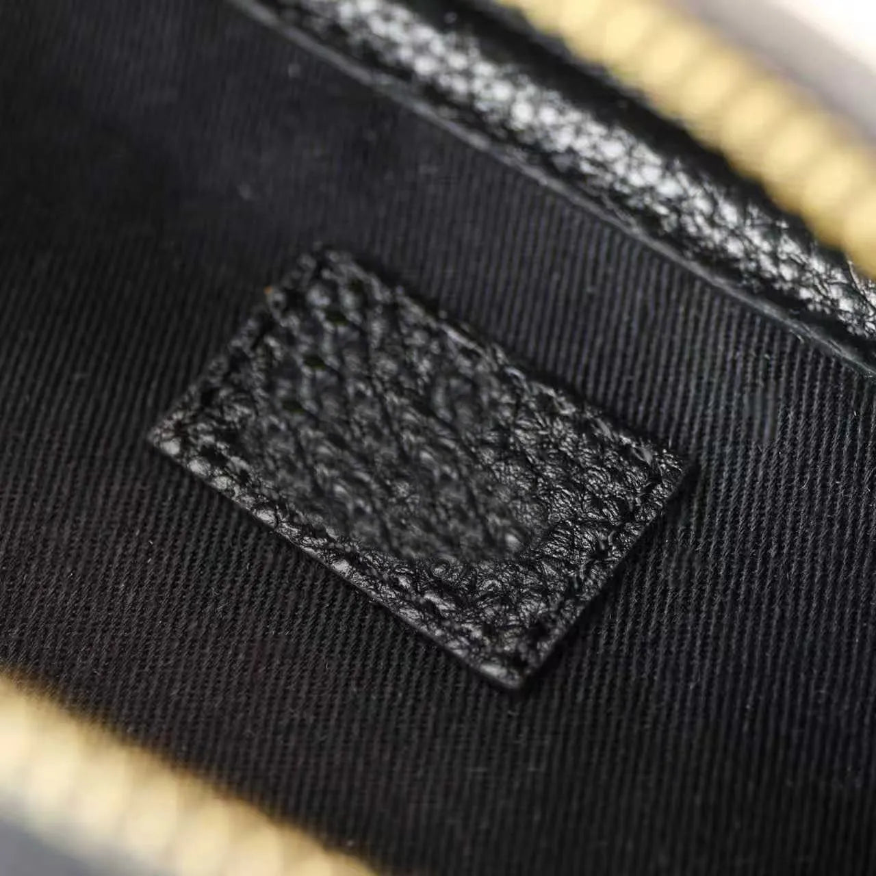 Front view of medium shoulder satchel bag showing structured design