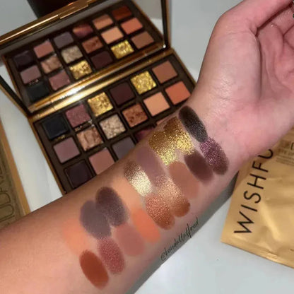 Close-up view of eyeshadow palette with matte and pearlescent glitter textures