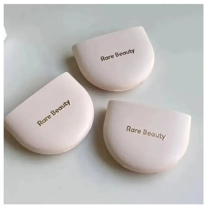 Close-up view showing the fine texture of the pressed powder in one compact