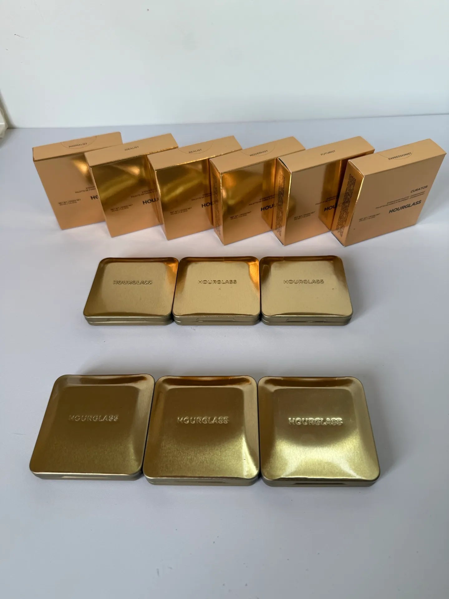 Close-up view of shimmery eyeshadow colors in compact palette