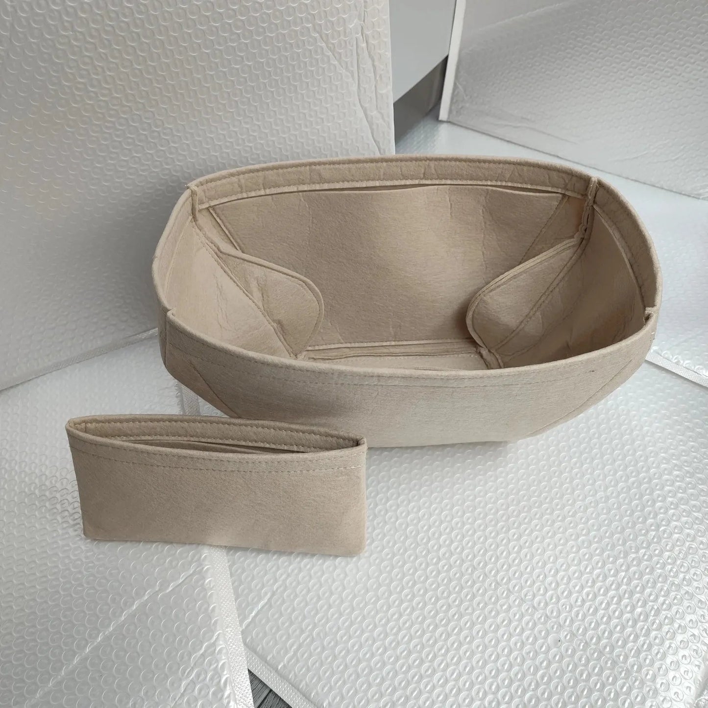 Lined storage organizer with multiple compartments open