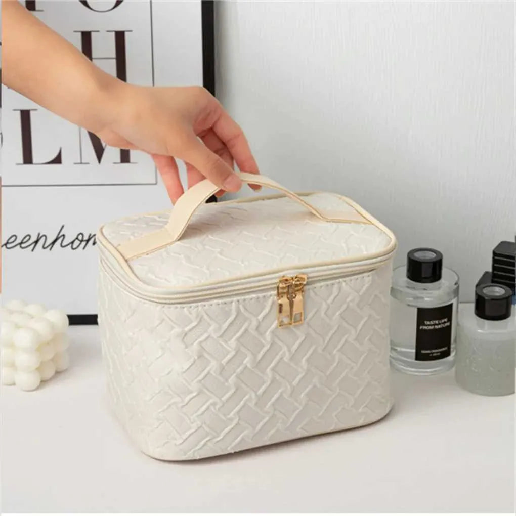 Front view of white square travel makeup bag with zipper closure