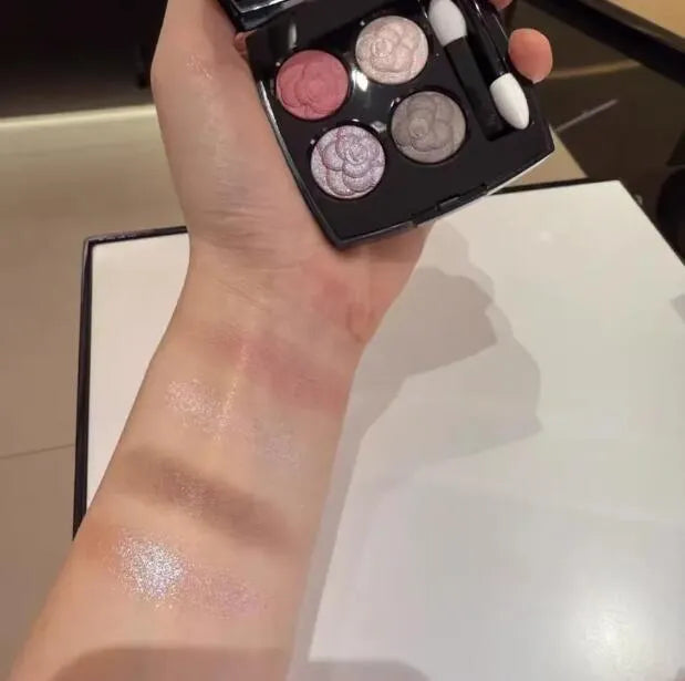 Four-color eyeshadow palette showing matte and shimmer shades