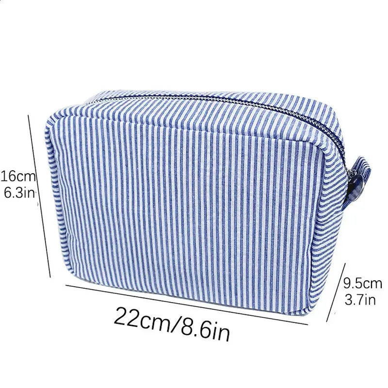 Cosmetic bag shown open to display interior storage capacity